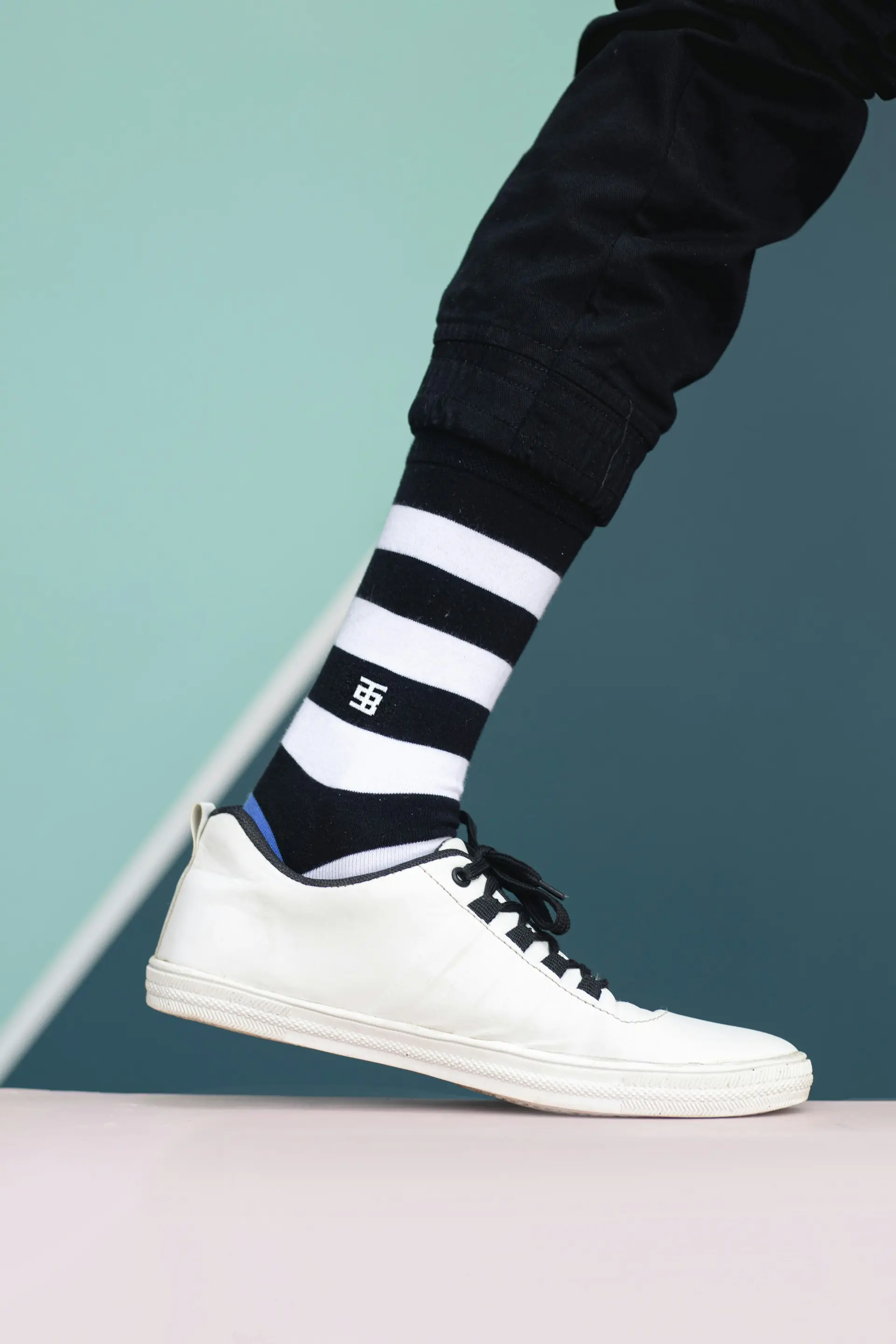 Striped shin-height socks, standing.