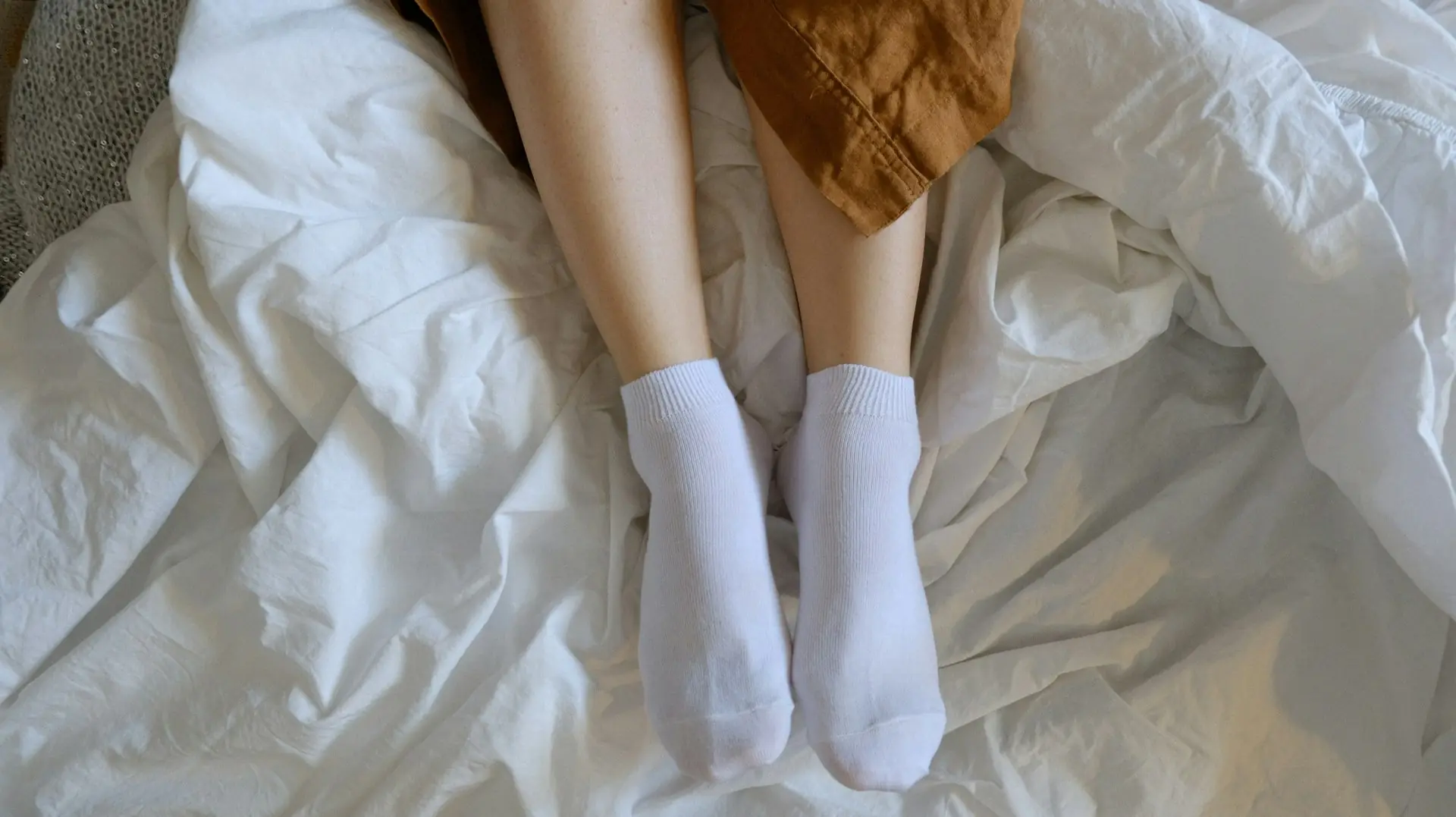 White mid socks on white linen.