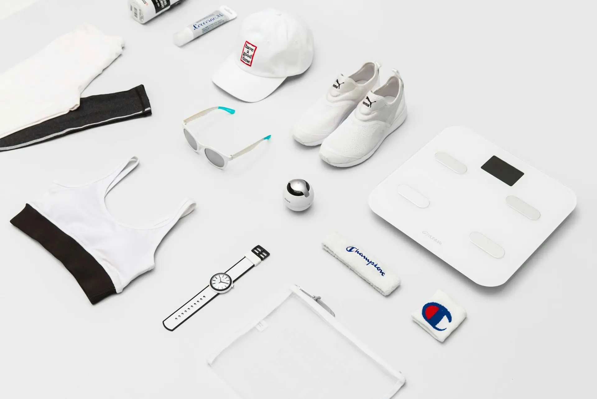 A training kit laid out flat: shoes, cap, glasses, kit.