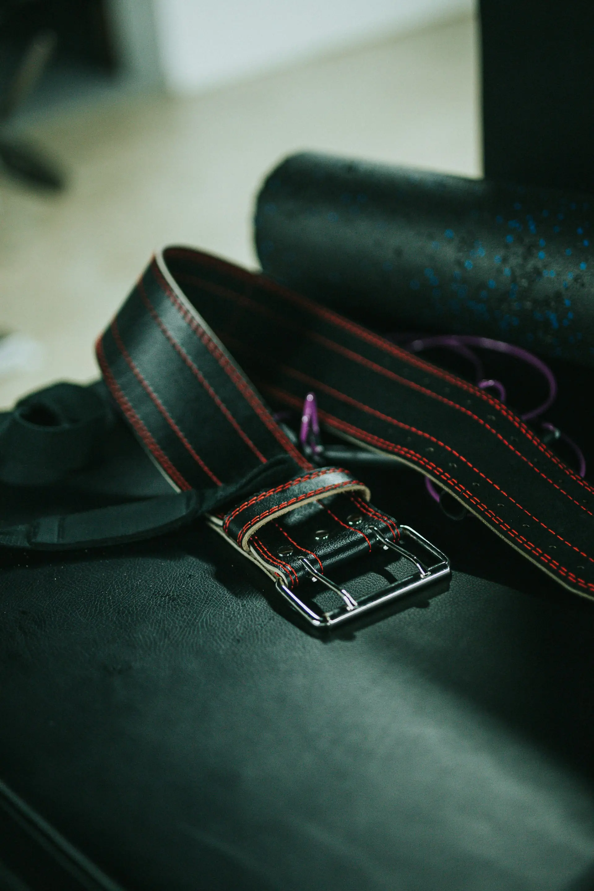 A black and silver belt buckle, up close.