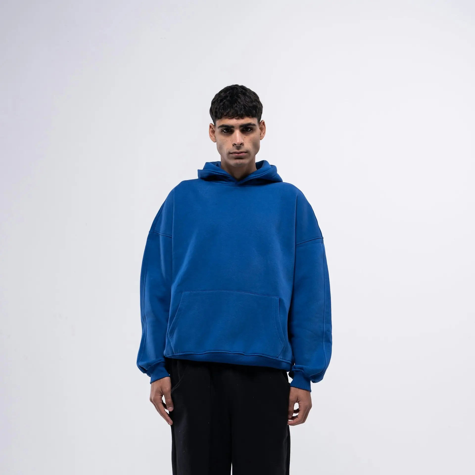 A man in a washed blue sweatshirt.