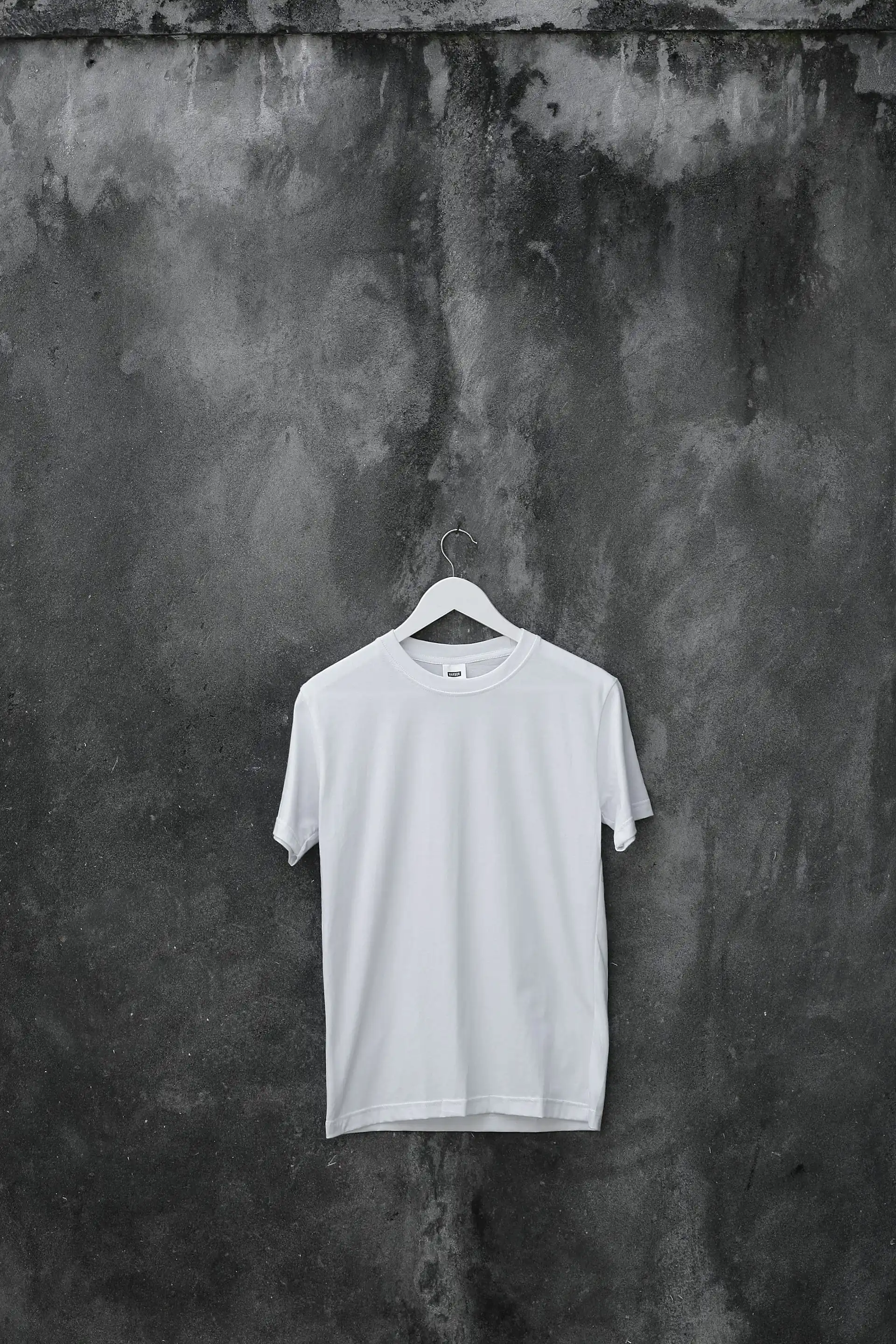 A white crew training tee, laid flat.