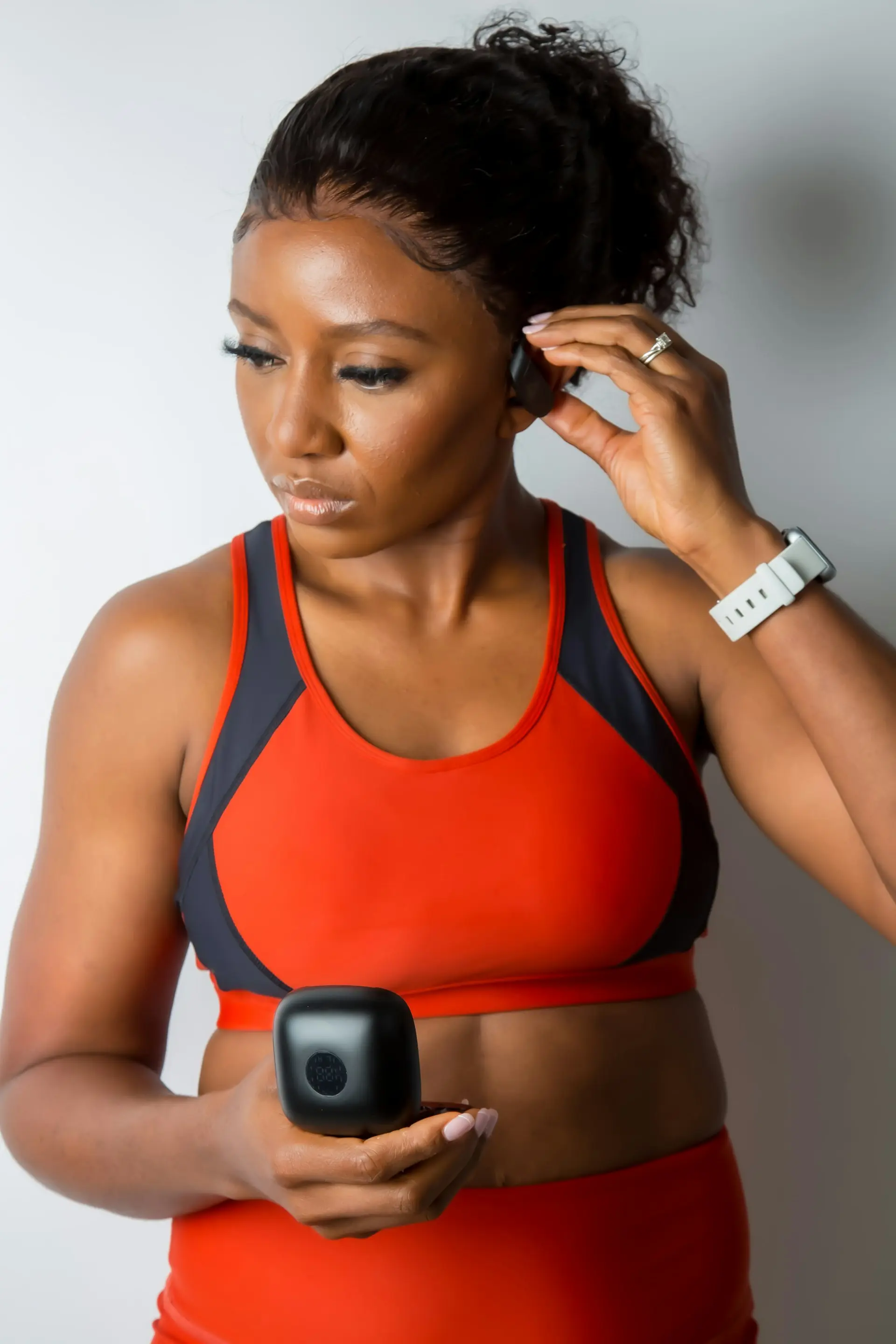 A woman in a bright high-support sports bra.