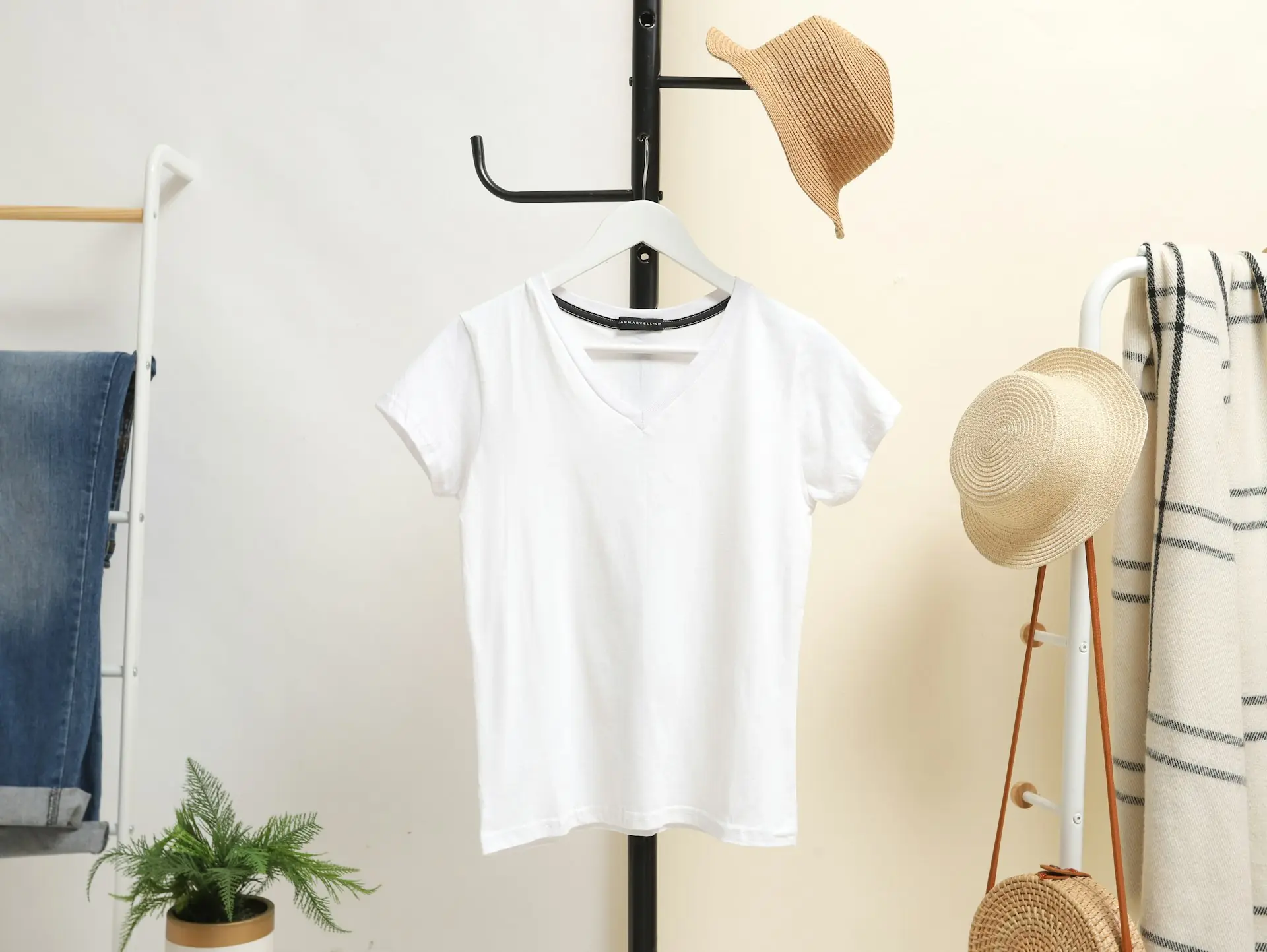 A white crew tee on a hanger.